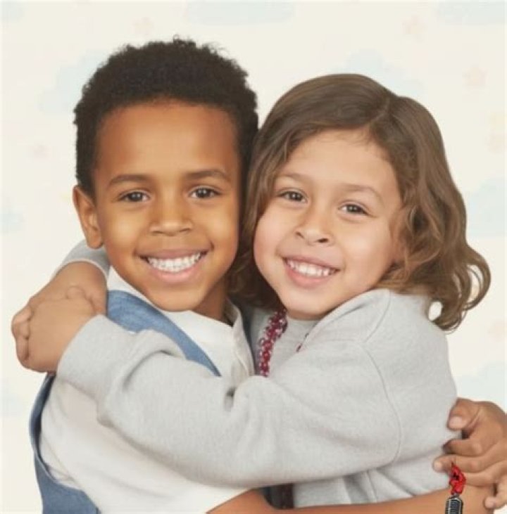 Aeko Brown, 11 Mos. Sucks His Thumb While Snuggling Mom Ammika Harris In Sweet Photo