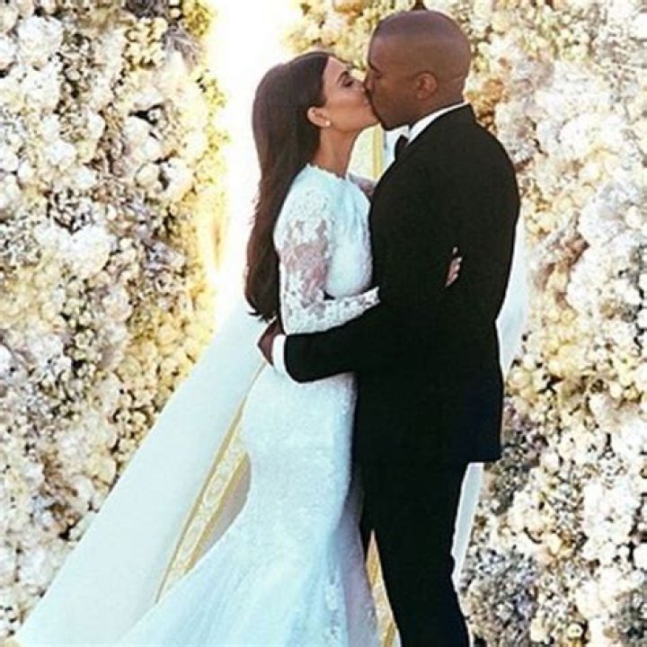 Kim Kardashian & Kanye West Share Steamy Tongue Kiss In Old Wedding Pic
