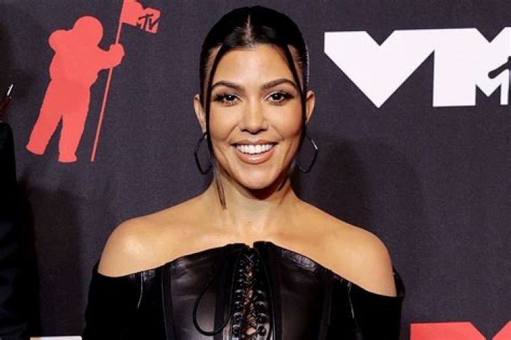 Kourtney Kardashian, 40, Rocks A Sexy Black Robe, Knee-Highs & Platform Heels In Bed